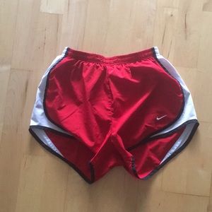 Red and black nike running shorts